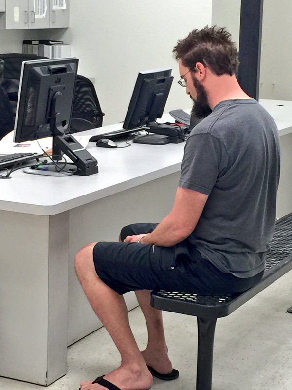 Suspect sitting at a computer