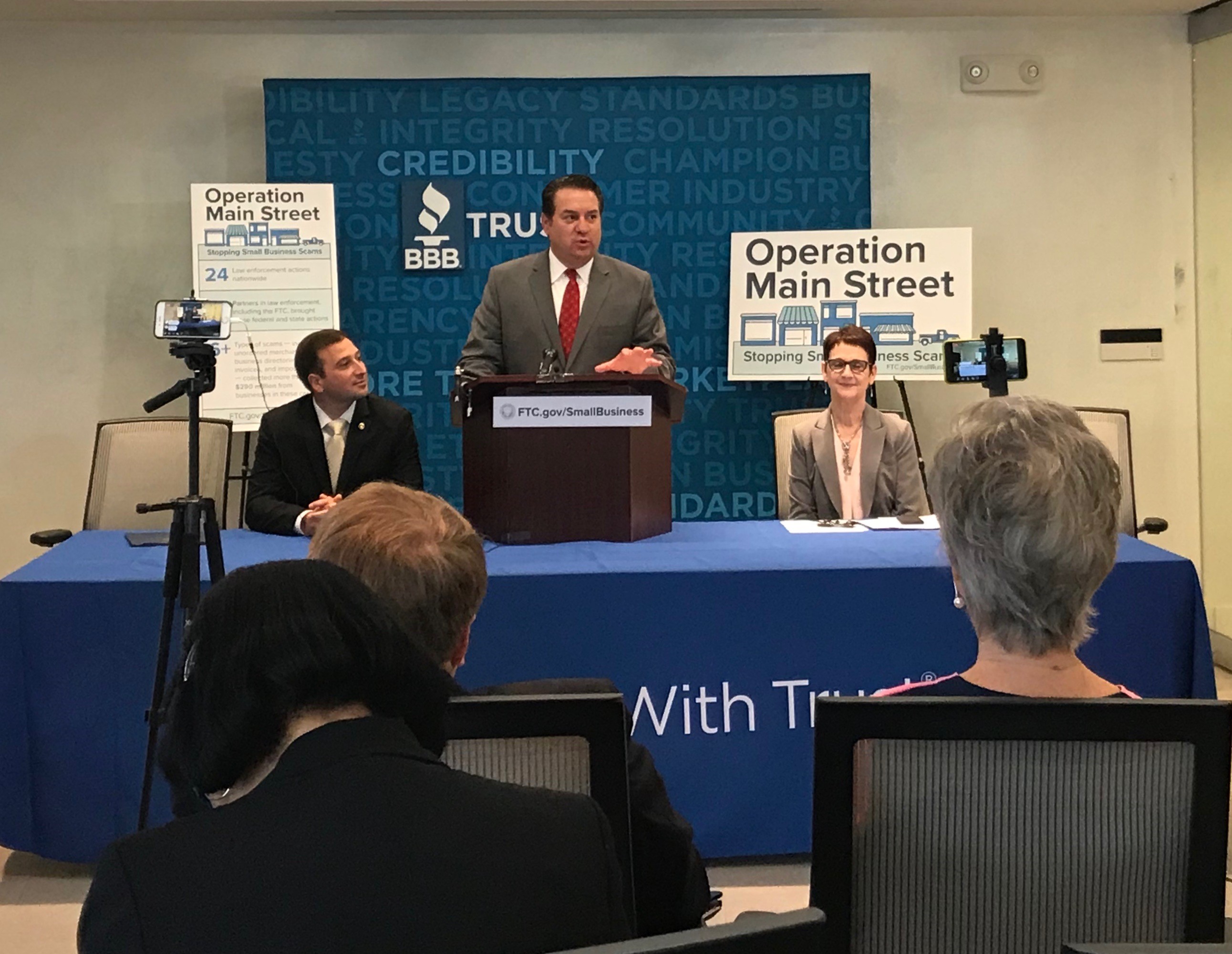 Attorney General Brnovich standing at a podium for a press conference