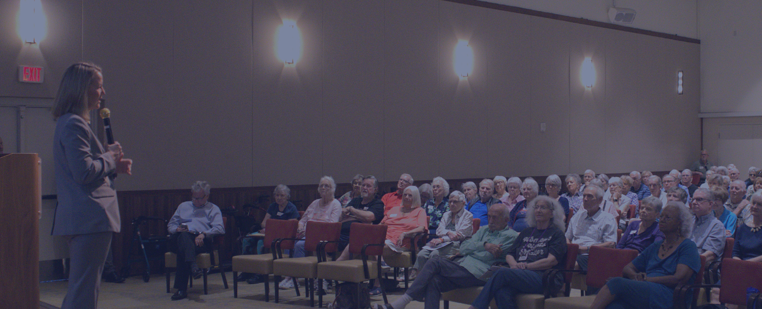 AG Mayes talking to a townhall crowd.